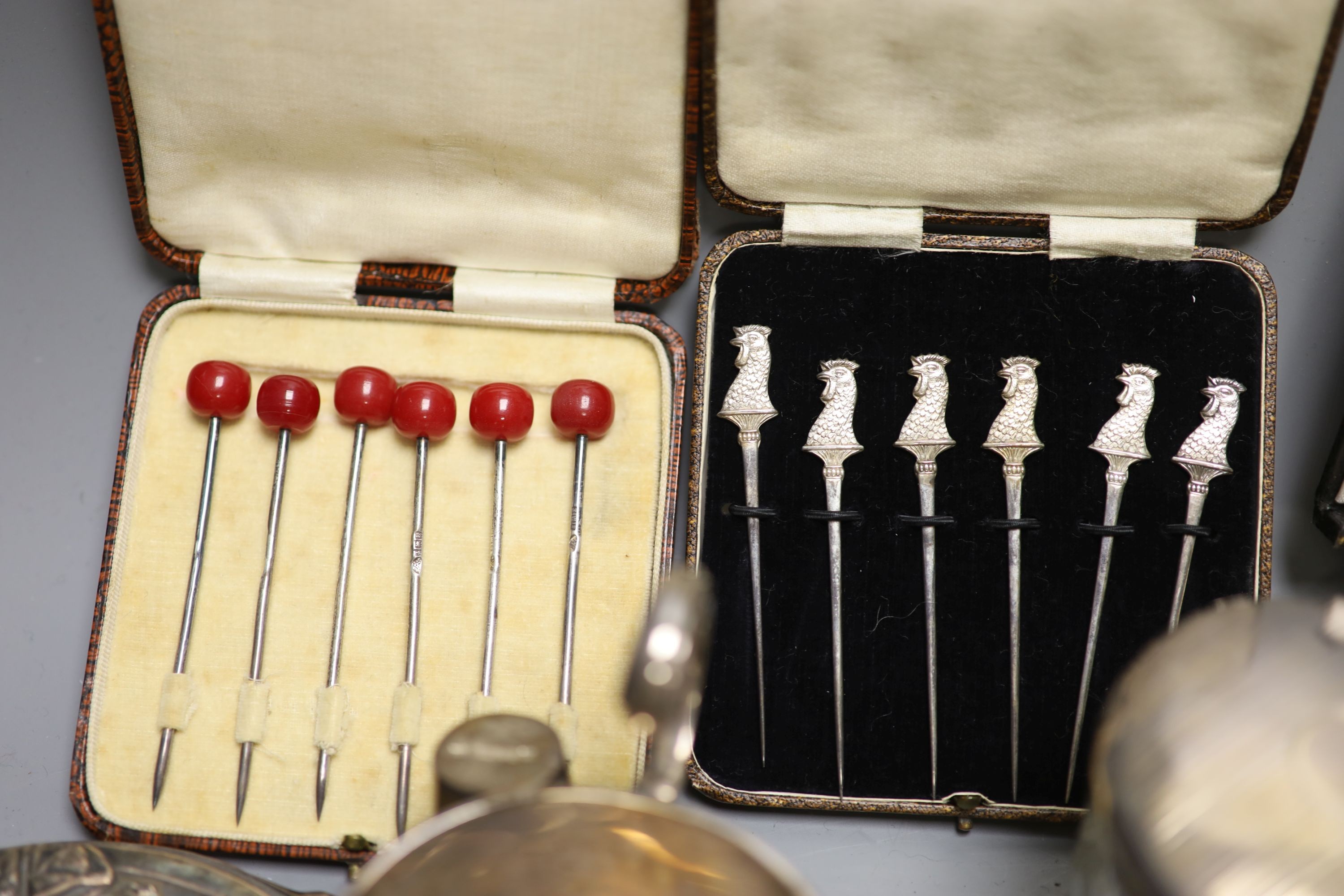 Assorted small silver including cased sets of cocktail sticks, sauceboat, toilet jars, cigarette box, cigarette cases and minor flatware etc.